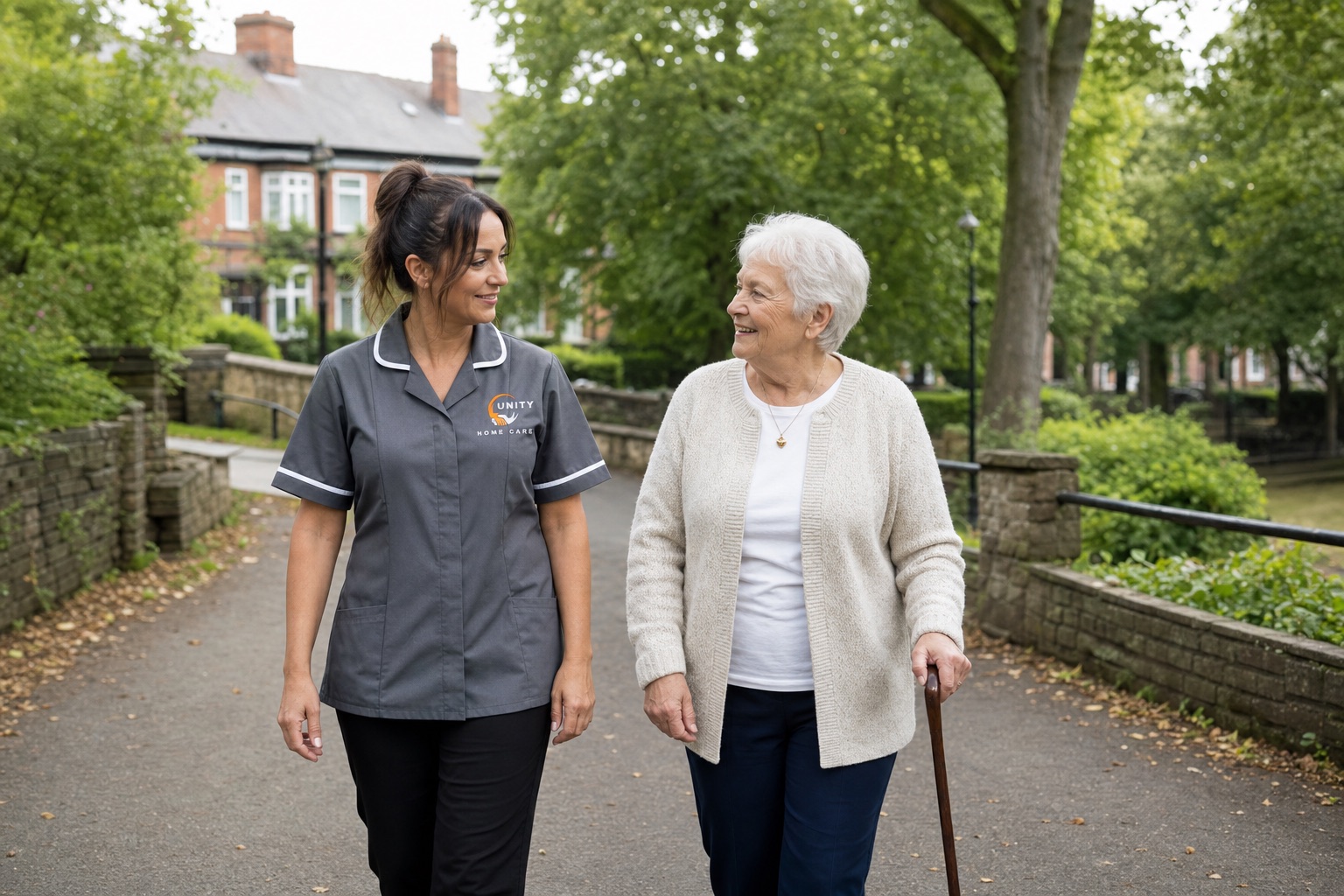 A Unity Home Care worker and older woman enjoying a walk together